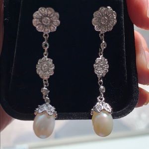 Silver and pearl dangling earrings. Never used.